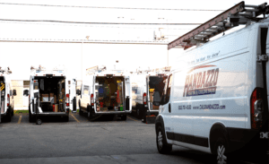 Randazzo Heating and Cooling Trucks ready and prepped for the work day. Main focus is a work van with the letter Randazzo on the side of the work van.