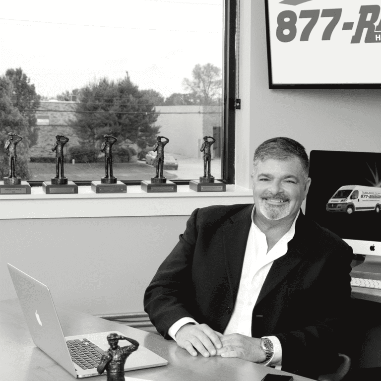 Pete sitting at his desk posing for a faces of HVAC Detroit magazine