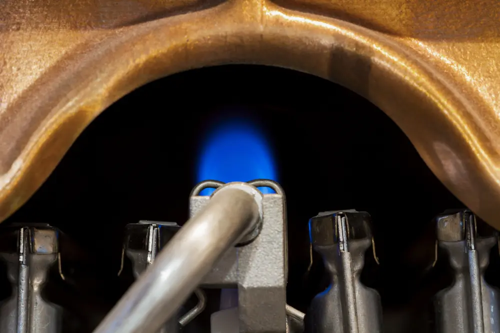 a close up of a blue flame on water heater